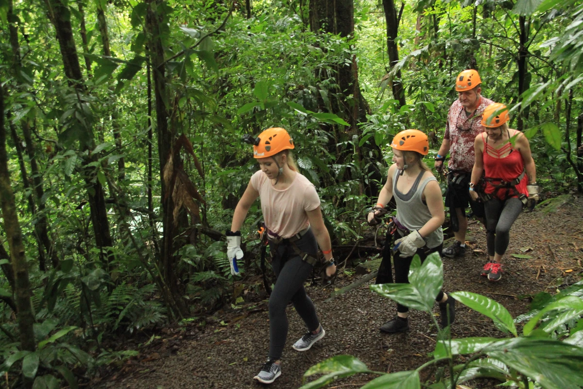 Zipline adventure over Costa Rica rainforest canopy with majestic Arenal Volcano in background at Vista Arenal Adventure Park